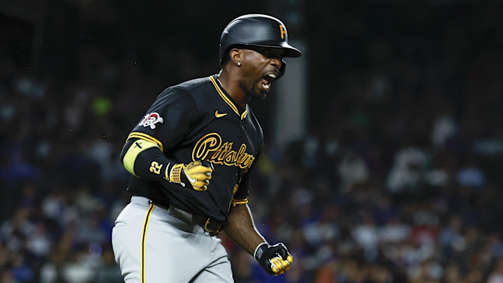 Pittsburgh Pirates outfielder Andrew McCutchen (22) celebrates as he rounds the bases after hitting a solo home run against the Chicago Cubs during the eight inning at Wrigley Field. 