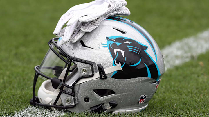 Jul 27, 2017; Spartanburg, SC, USA; Carolina Panthers logo helmet and gloves wait on the turf during Panthers Training Camp at Wofford College. Mandatory Credit: Jim Dedmon-Imagn Images Jul 27, 2017; Spartanburg, SC, USA; Carolina Panthers logo helmet and gloves wait on the turf during Panthers Training Camp at Wofford College. Mandatory Credit: Jim Dedmon-Imagn Images