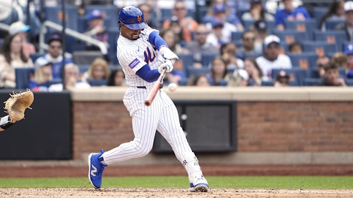 Jun 1, 2025; New York City, New York, USA; New York Mets shortstop Francisco Lindor (12) hits a home run against the Colorado Rockies during the fifth inning at Citi Field. Mandatory Credit: Gregory Fisher-Imagn Images