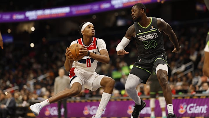 Washington Wizards guard Bilal Coulibaly drives to the basket as Minnesota Timberwolves forward Julius Randle defends in the second quarter at Capital One Arena in Washington on Jan. 13, 2025.