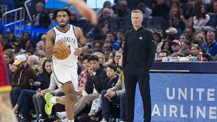 Nov 25, 2024; San Francisco, California, USA; Brooklyn Nets guard Cam Thomas (24) dribbles in font of Golden State Warriors head coach Steve Kerr during the first half at Chase Center. Mandatory Credit: John Hefti-Imagn Images