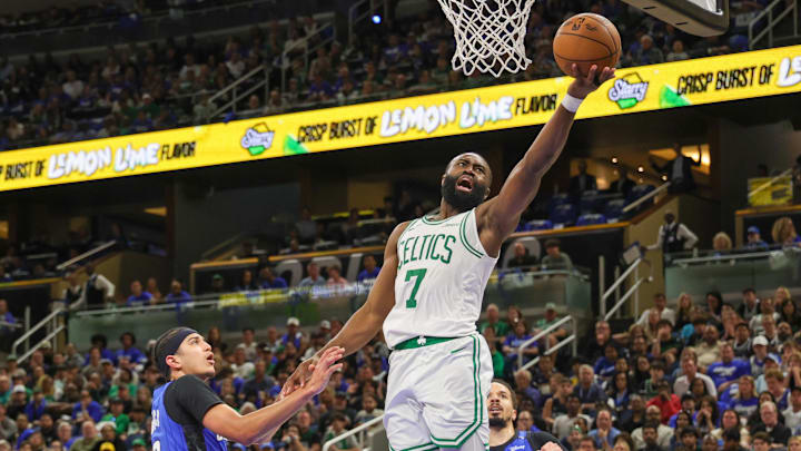 Apr 25, 2025; Orlando, Florida, USA; Boston Celtics guard Jaylen Brown (7) goes to the basket against Orlando Magic guard Anthony Black (0) during the second half of game three of first round for the 2024 NBA Playoffs at Kia Center. Mandatory Credit: Mike Watters-Imagn Images