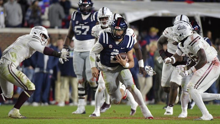 Nov 29, 2024; Oxford, Mississippi, USA; Mississippi Rebels quarterback Jaxson Dart (2) runs the ball against the Mississippi State Bulldogs during the fourth quarter at Vaught-Hemingway Stadium. Mandatory Credit: Matt Bush-Imagn Images