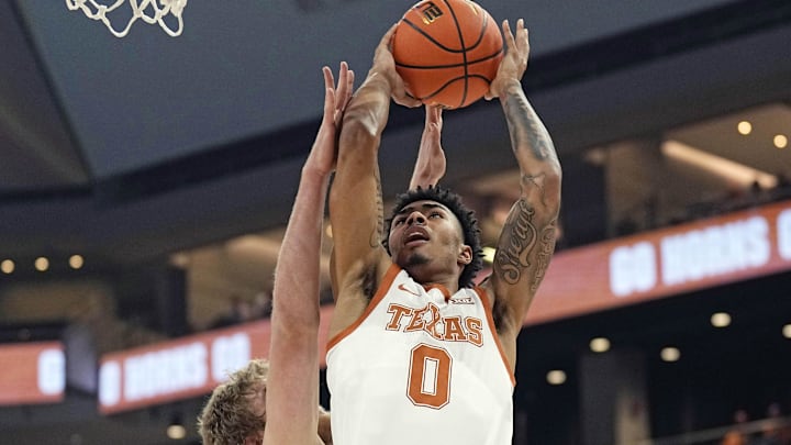 Nov 15, 2023; Austin, Texas, USA; Texas Longhorns guard Chris Johnson (0) drives to the basket during the first half against the Rice Owls at Moody Center. Mandatory Credit: Scott Wachter-Imagn Images