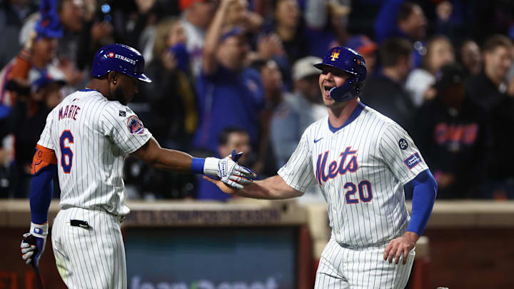 Oct 18, 2024; New York City, New York, USA; New York Mets first baseman Pete Alonso (20) high-fives right fielder Starling Marte (6) after scoring during the fourth inning against the Los Angeles Dodgers during game five of the NLCS for the 2024 MLB playoffs at Citi Field. Oct 18, 2024; New York City, New York, USA; New York Mets first baseman Pete Alonso (20) high-fives right fielder Starling Marte (6) after scoring during the fourth inning against the Los Angeles Dodgers during game five of the NLCS for the 2024 MLB playoffs at Citi Field.