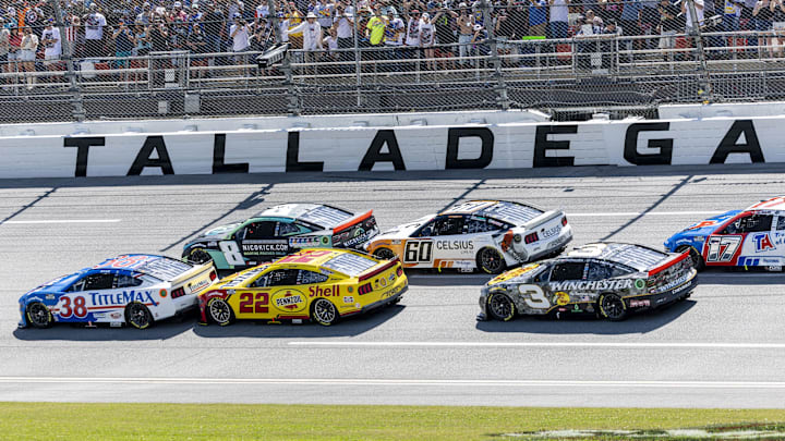 Apr 27, 2025; Talladega, Alabama, USA; NASCAR Cup Series drivers Zane Smith (38) and Kyle Busch (8) battle for an early lead during stage one of the NASCAR: Jack Link's 500 at Talladega Superspeedway.