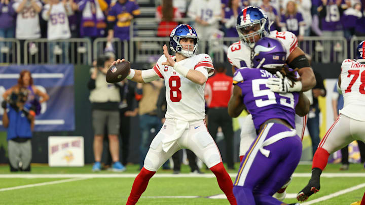 Jan 15, 2023; Minneapolis, Minnesota, USA; New York Giants quarterback Daniel Jones (8) looks to pass the ball against the Minnesota Vikings during the first quarter of a wild card game at U.S. Bank Stadium. Mandatory Credit: Matt Krohn-Imagn Images