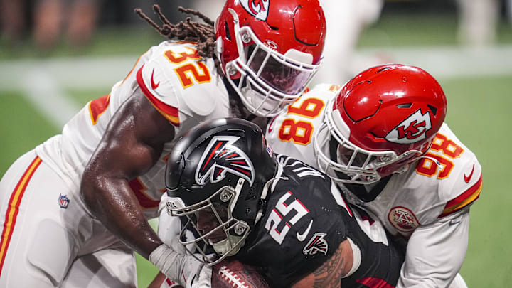 Sep 22, 2024; Atlanta, Georgia, USA; Kansas City Chiefs linebacker Nick Bolton (32) and defensive tackle Tershawn Wharton (98) tackle Atlanta Falcons running back Tyler Allgeier (25) during the second half at Mercedes-Benz Stadium. Mandatory Credit: Dale Zanine-Imagn Images Sep 22, 2024; Atlanta, Georgia, USA; Kansas City Chiefs linebacker Nick Bolton (32) and defensive tackle Tershawn Wharton (98) tackle Atlanta Falcons running back Tyler Allgeier (25) during the second half at Mercedes-Benz Stadium. Mandatory Credit: Dale Zanine-Imagn Images