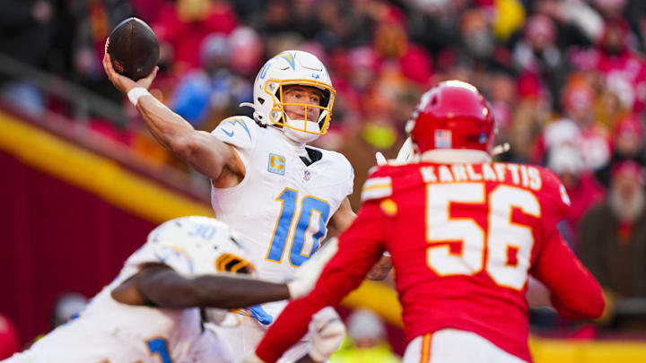 Dec 14, 2025; Kansas City, Missouri, USA; Los Angeles Chargers quarterback Justin Herbert (10) passes against the Kansas City Chiefs during the fourth quarter at GEHA Field at Arrowhead Stadium. Mandatory Credit: Jay Biggerstaff-Imagn Images