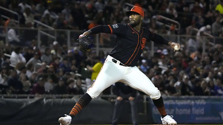 San Francisco Giants pitcher Amir Garrett (18) throws