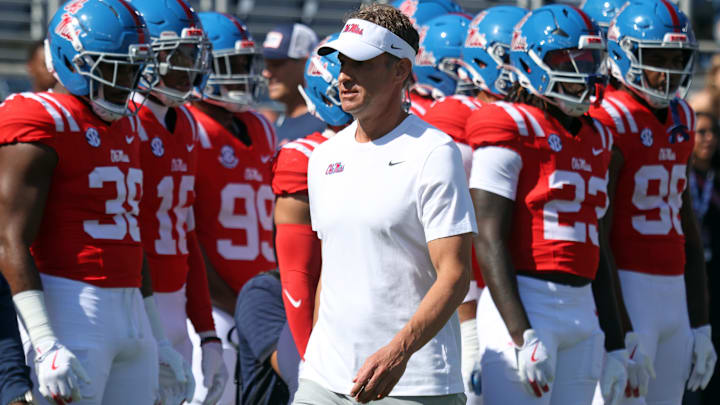 Oct 11, 2025; Oxford, Mississippi, USA; Mississippi Rebels head coach Lane Kiffin looks on during warm ups prior to the game against the Washington State Cougars at Vaught-Hemingway Stadium. Mandatory Credit: Petre Thomas-Imagn Images Oct 11, 2025; Oxford, Mississippi, USA; Mississippi Rebels head coach Lane Kiffin looks on during warm ups prior to the game against the Washington State Cougars at Vaught-Hemingway Stadium. Mandatory Credit: Petre Thomas-Imagn Images