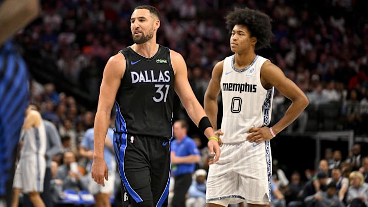 Nov 22, 2025; Dallas, Texas, USA; Dallas Mavericks guard Klay Thompson (31) and Memphis Grizzlies forward Jaylen Wells (0) look on during the game between the Mavericks and the Grizzlies at American Airlines Center. Mandatory Credit: Jerome Miron-Imagn Images