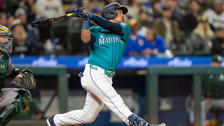 Seattle Mariners designated hitter Jorge Polanco hits a single against the Oakland Athletics on Sept. 28 at T-Mobile Park.