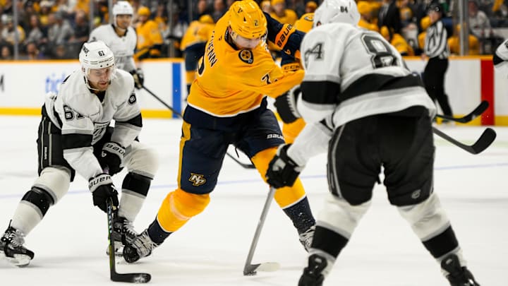 Nov 4, 2024; Nashville, Tennessee, USA;  Nashville Predators defenseman Luke Schenn (2) takes a shot on goal against the Los Angeles Kings during the third period at Bridgestone Arena. Mandatory Credit: Steve Roberts-Imagn Images