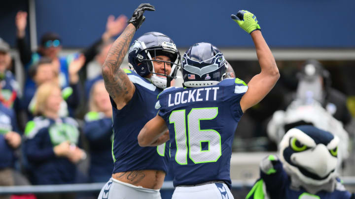 Oct 22, 2023; Seattle, Washington, USA; Seattle Seahawks wide receiver Jaxon Smith-Njigba (11) and Seattle Seahawks wide receiver Tyler Lockett (16) celebrate after Jaxon Smith-Njigba scored a touchdown against the Arizona Cardinals during the first half at Lumen Field. Oct 22, 2023; Seattle, Washington, USA; Seattle Seahawks wide receiver Jaxon Smith-Njigba (11) and Seattle Seahawks wide receiver Tyler Lockett (16) celebrate after Jaxon Smith-Njigba scored a touchdown against the Arizona Cardinals during the first half at Lumen Field.