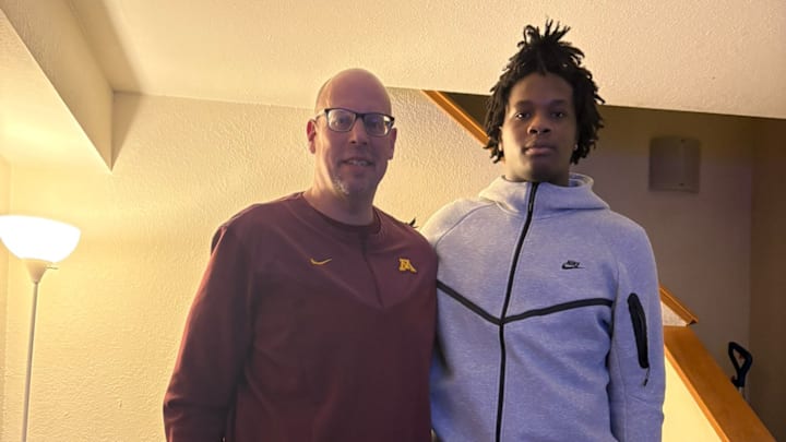 Gophers offensive line coach Brian Callhan with Lakeville South offensive lineman Joseph Hamer. Gophers offensive line coach Brian Callhan with Lakeville South offensive lineman Joseph Hamer.