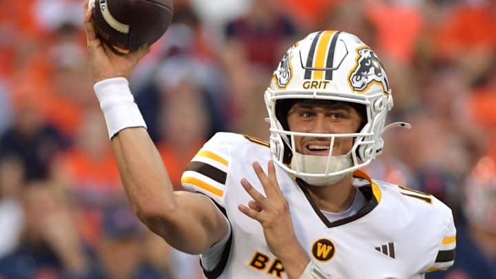 Sep 13, 2025; Champaign, Illinois, USA;  Western Michigan Broncos quarterback Brady Jones (10) passes the ball against the Illinois Fighting Illini at Memorial Stadium. Mandatory Credit: Ron Johnson-Imagn Images