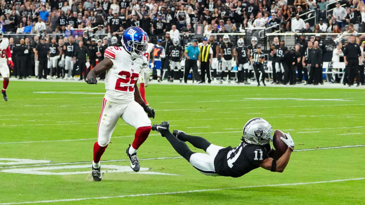 Nov 5, 2023; Paradise, Nevada, USA; Las Vegas Raiders wide receiver Tre Tucker (11) makes a catch ahead of New York Giants cornerback Deonte Banks (25) during the second quarter at Allegiant Stadium.  