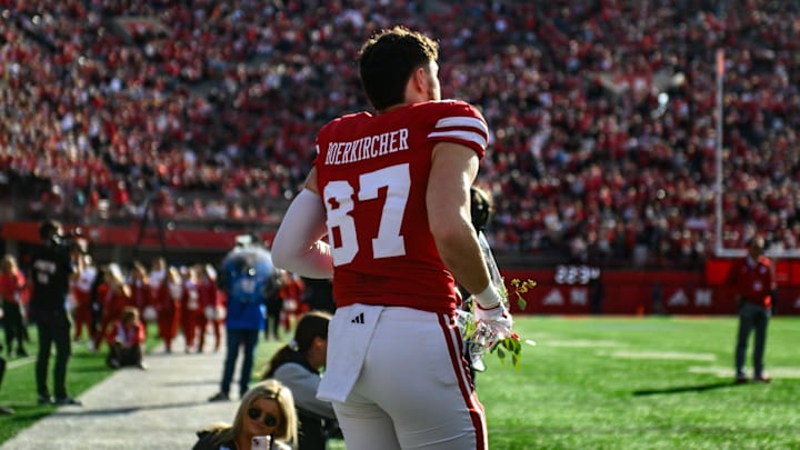 Nate Boerkircher runs out of the tunnel during his senior day introduction. 