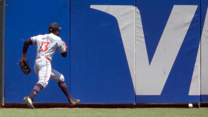 Jul 14, 2024; San Francisco, California, USA; Minnesota Twins center fielder Manuel Margot (13) runs down a double off the bat of San Francisco Giants first baseman LaMonte Wade Jr. during the third inning at Oracle Park. Mandatory Credit: D. Ross Cameron-USA TODAY Sports