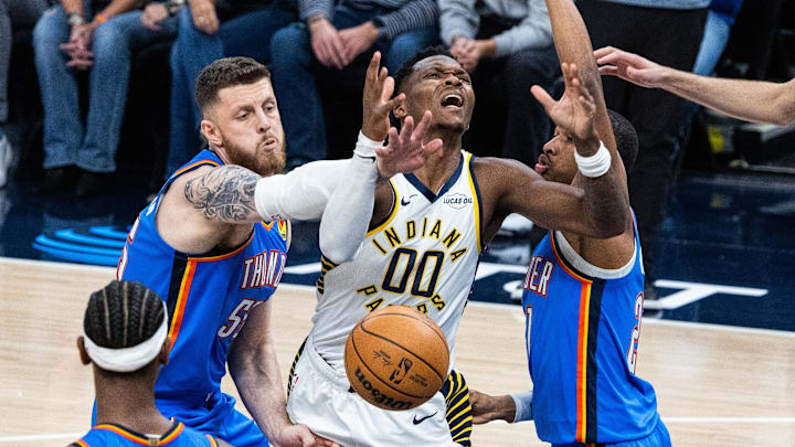 Oct 23, 2025; Indianapolis, Indiana, USA; Indiana Pacers guard Bennedict Mathurin (00) has his shoot attempt blocked by Oklahoma City Thunder center Isaiah Hartenstein (55) in the first half at Gainbridge Fieldhouse. Mandatory Credit: Trevor Ruszkowski-Imagn Images