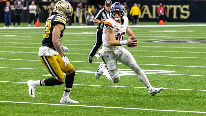 Oct 17, 2024; New Orleans, Louisiana, USA;  Denver Broncos quarterback Bo Nix (10) is tackled by New Orleans Saints cornerback Marshon Lattimore (23) during the first half at Caesars Superdome. 