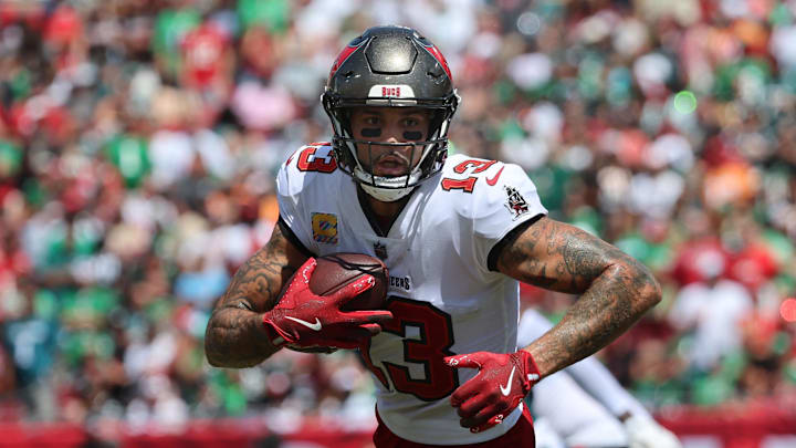 Sep 29, 2024; Tampa, Florida, USA; Tampa Bay Buccaneers wide receiver Mike Evans (13) runs with the ball against the Philadelphia Eagles during the first half at Raymond James Stadium. Mandatory Credit: Kim Klement Neitzel-Imagn Images