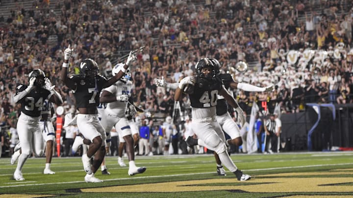 Sep 20, 2025; Nashville, Tennessee, USA;  Vanderbilt Commodores linebacker Jamison Curtis (40) scores on a block punt against the Georgia State Panthers during the second half at FirstBank Stadium. Mandatory Credit: Steve Roberts-Imagn Images