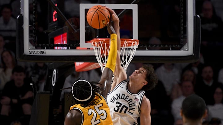 Vanderbilt Commodores guard Chris Manon (30) blocks the shot of  Missouri Tigers guard Mark Mitchell (25) during the first half at Memorial Gymnasium.