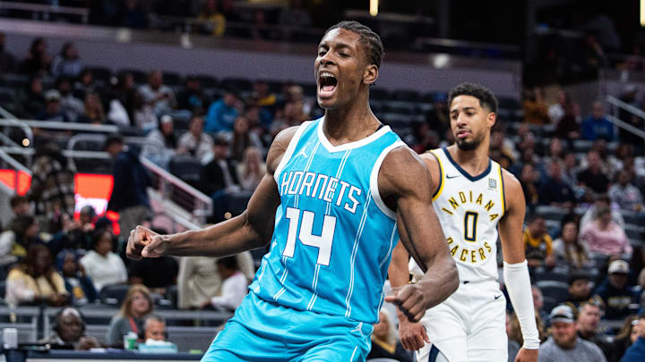 Oct 17, 2024; Indianapolis, Indiana, USA; Charlotte Hornets forward Moussa Diabate (14) celebrates a made basket in the second half against the Indiana Pacers at Gainbridge Fieldhouse. Mandatory Credit: Trevor Ruszkowski-Imagn Images