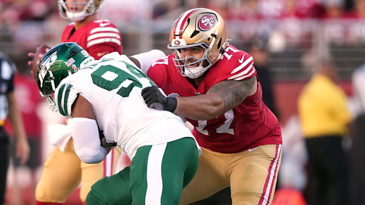 Sep 9, 2024; Santa Clara, California, USA; San Francisco 49ers guard Dominick Puni (77) blocks New York Jets defensive end Solomon Thomas (left) during the first quarter at Levi's Stadium. Mandatory Credit: Darren Yamashita-Imagn Images
