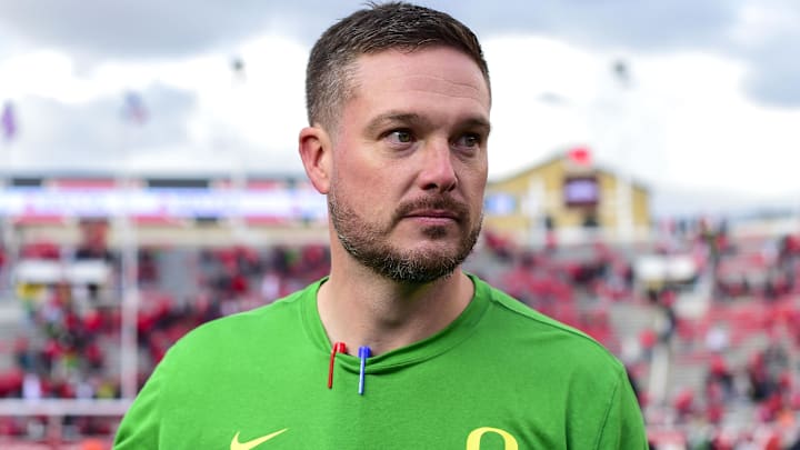 Oct 28, 2023; Salt Lake City, Utah, USA; Oregon Ducks head coach Dan Lanning congratulates players after defeating the Utah Utes at Rice-Eccles Stadium. Mandatory Credit: Christopher Creveling-Imagn Images Oct 28, 2023; Salt Lake City, Utah, USA; Oregon Ducks head coach Dan Lanning congratulates players after defeating the Utah Utes at Rice-Eccles Stadium. Mandatory Credit: Christopher Creveling-Imagn Images