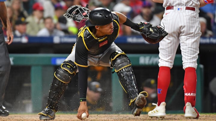 Pittsburgh Pirates catcher Endy Rodriguez (25) reaches for the ball in the dirt against the Philadelphia Phillies during the fifth inning at Citizens Bank Park. 