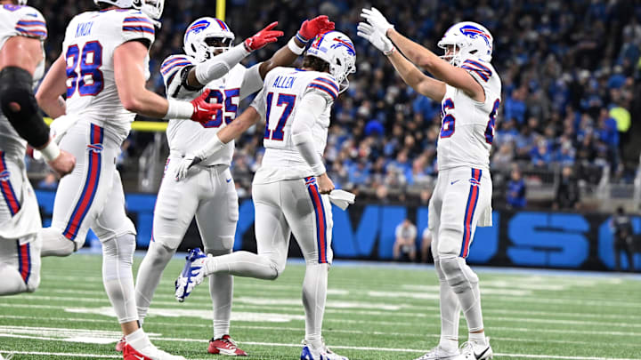 Buffalo Bills quarterback Josh Allen celebrates with tight ends Quintin Morris and Dalton Kincaid  after scoring his second touchdown against the Detroit Lions.