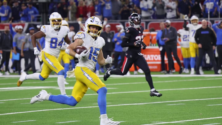Jan 11, 2025; Houston, Texas, USA;  Los Angeles Chargers wide receiver Ladd McConkey (15) scores on a pass in the fourth quarter against the Houston Texans in an AFC wild card game at NRG Stadium. Mandatory Credit: Thomas Shea-Imagn Images