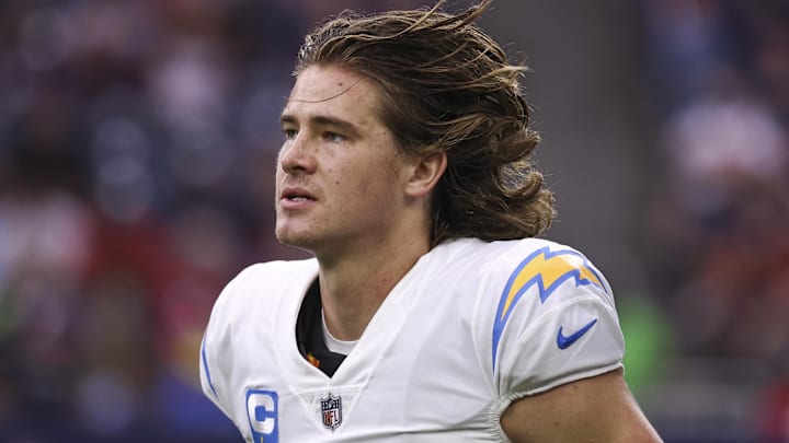 Dec 26, 2021; Houston, Texas, USA; Los Angeles Chargers quarterback Justin Herbert (10) jogs off the field during the game against the Houston Texans at NRG Stadium. Mandatory Credit: Troy Taormina-Imagn Images
