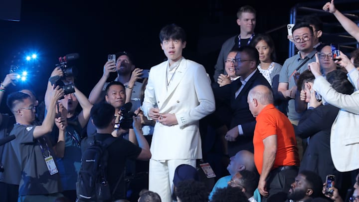 Jun 25, 2025; Brooklyn, NY, USA; Yang Hansen walks to the stage after being selected as the 16th pick by the Memphis Grizzlies in the first round of the 2025 NBA Draft at Barclays Center. Mandatory Credit: Brad Penner-Imagn Images Jun 25, 2025; Brooklyn, NY, USA; Yang Hansen walks to the stage after being selected as the 16th pick by the Memphis Grizzlies in the first round of the 2025 NBA Draft at Barclays Center. Mandatory Credit: Brad Penner-Imagn Images