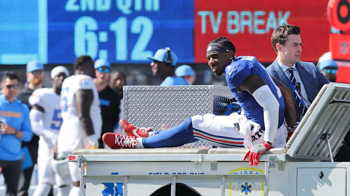 Sep 28, 2025; East Rutherford, New Jersey, USA; New York Giants wide receiver Malik Nabers (1) is carted off the field following an injury during the second quarter against the Los Angeles Chargers at MetLife Stadium. Mandatory Credit: Brad Penner-Imagn Images