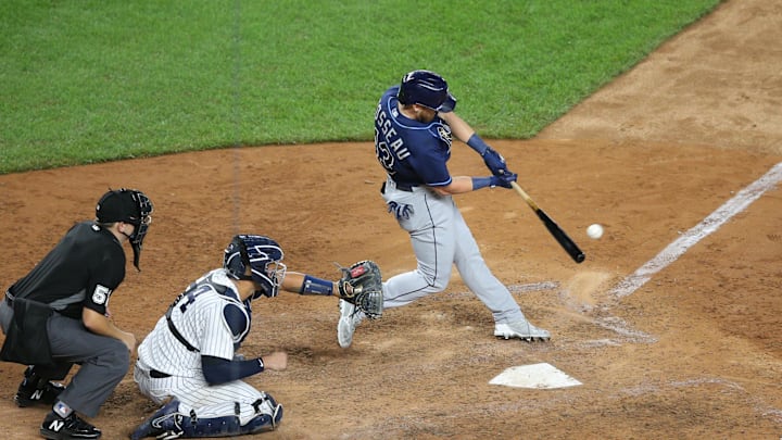 Aug 19, 2020; Bronx, New York, USA; Tampa Bay Rays pinch hitter Mike Brosseau (43) hits an RBI single against the New York Yankees during the eighth inning at Yankee Stadium. Mandatory Credit: Brad Penner-Imagn Images