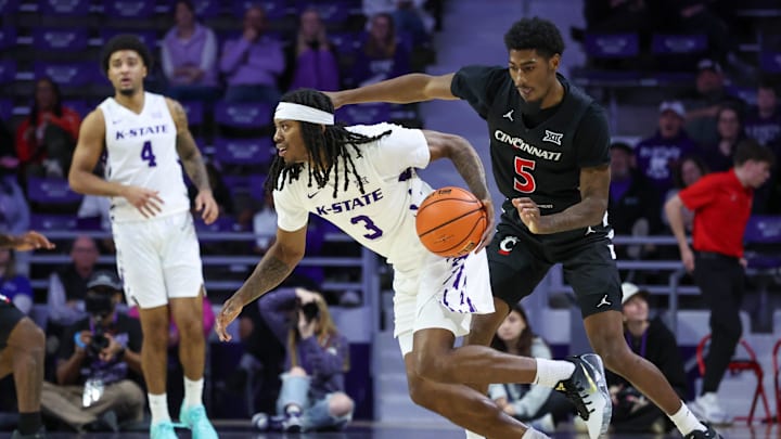 Feb 11, 2026; Manhattan, Kansas, USA; Kansas State Wildcats guard C.J. Jones (3) dribbles by Cincinnati Bearcats guard Sencire Harris (5) during the first half at Bramlage Coliseum. Feb 11, 2026; Manhattan, Kansas, USA; Kansas State Wildcats guard C.J. Jones (3) dribbles by Cincinnati Bearcats guard Sencire Harris (5) during the first half at Bramlage Coliseum.