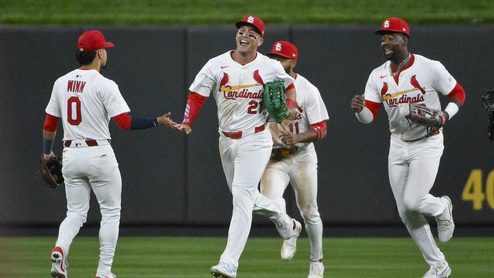 May 6, 2025; St. Louis, Missouri, USA;  St. Louis Cardinals left fielder Lars Nootbaar (21) shortstop Masyn Winn (0) center fielder Victor Scott II (11) and right fielder Jordan Walker (18) celebrate after the Cardinals defeated the Pittsburgh Pirates at Busch Stadium. Mandatory Credit: Jeff Curry-Imagn Images