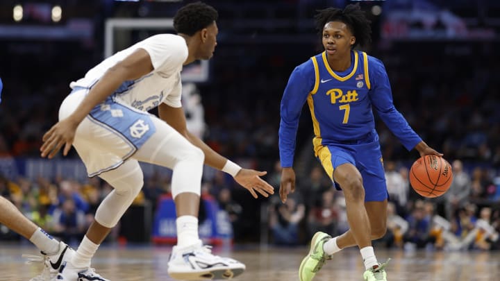 Mar 15, 2024; Washington, D.C., USA; Pittsburgh Panthers guard Carlton Carrington (7) drives to the basket as North Carolina Tar Heels forward Jalen Washington (13) defends in the first half at Capital One Arena. Mandatory Credit: Geoff Burke-USA TODAY Sports