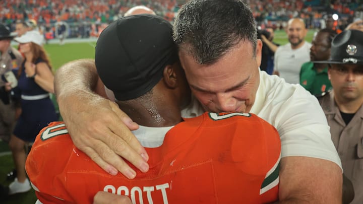 Aug 31, 2025; Miami Gardens, Florida, USA; Miami Hurricanes head coach Mario Cristobal reacts after defeating the Notre Dame Fighting Irish at Hard Rock Stadium. Mandatory Credit: Sam Navarro-Imagn Images