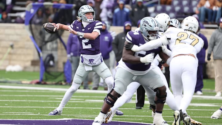 Nov 29, 2025; Manhattan, Kansas, USA; Kansas State Wildcats quarterback Avery Johnson (2) drops back to pass during the fourth quarter against the Colorado Buffaloes at Bill Snyder Family Football Stadium. 