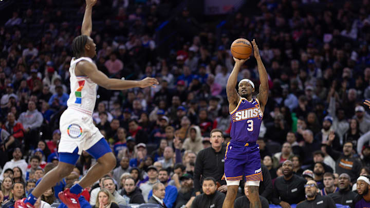 Jan 6, 2025; Philadelphia, Pennsylvania, USA; Phoenix Suns guard Bradley Beal (3) shoots in front of Philadelphia 76ers guard Tyrese Maxey (0) during the third quarter at Wells Fargo Center. Mandatory Credit: Bill Streicher-Imagn Images