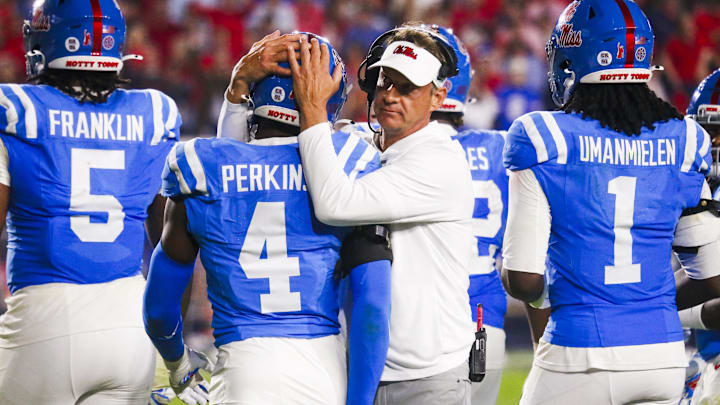 Nov 15, 2025; Oxford, Mississippi, USA; Mississippi Rebels head coach Lane Kiffin embraces linebacker Suntarine Perkins (4) during the second half against the Florida Gators at Vaught-Hemingway Stadium. Mandatory Credit: Petre Thomas-Imagn Images Nov 15, 2025; Oxford, Mississippi, USA; Mississippi Rebels head coach Lane Kiffin embraces linebacker Suntarine Perkins (4) during the second half against the Florida Gators at Vaught-Hemingway Stadium. Mandatory Credit: Petre Thomas-Imagn Images