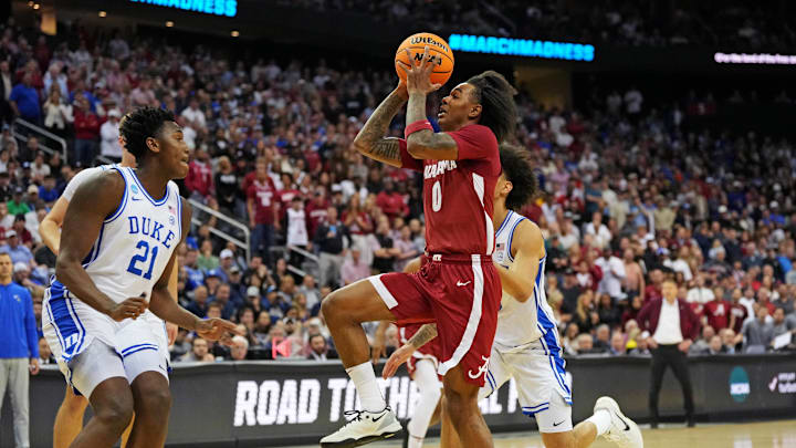 Mar 29, 2025; Newark, NJ, USA; Alabama Crimson Tide guard Labaron Philon (0) shoots the ball against Duke Blue Devils center Patrick Ngongba II (21) during the first half in the East Regional final of the 2025 NCAA tournament at Prudential Center. Mandatory Credit: Robert Deutsch-Imagn Images Mar 29, 2025; Newark, NJ, USA; Alabama Crimson Tide guard Labaron Philon (0) shoots the ball against Duke Blue Devils center Patrick Ngongba II (21) during the first half in the East Regional final of the 2025 NCAA tournament at Prudential Center. Mandatory Credit: Robert Deutsch-Imagn Images