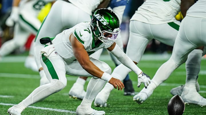 Nov 13, 2025; Foxborough, Massachusetts, USA; New York Jets quarterback Justin Fields (7) looses the ball on the snap against the New England Patriots in the fourth quarter at Gillette Stadium. Mandatory Credit: David Butler II-Imagn Images