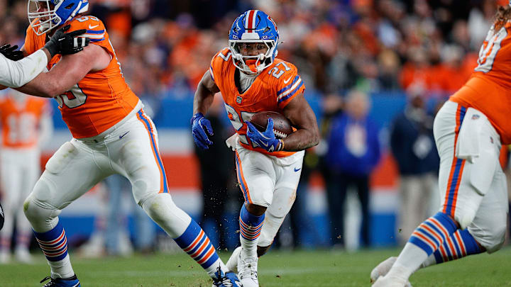 Nov 6, 2025; Denver, Colorado, USA; Denver Broncos running back J.K. Dobbins (27) runs the ball in the fourth quarter against the Las Vegas Raiders at Empower Field at Mile High. Mandatory Credit: Isaiah J. Downing-Imagn Images