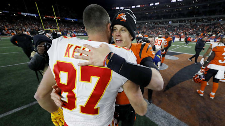 Dec 4, 2022; Cincinnati, Ohio, USA; Cincinnati Bengals quarterback Joe Burrow (9) and Kansas City Chiefs tight end Travis Kelce (87) meet following the game at Paycor Stadium. Mandatory Credit: Joseph Maiorana-Imagn Images